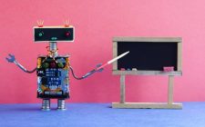 Robot teacher explains modern theory. Classroom interior with empty black chalkboard. Pink blue colorful background